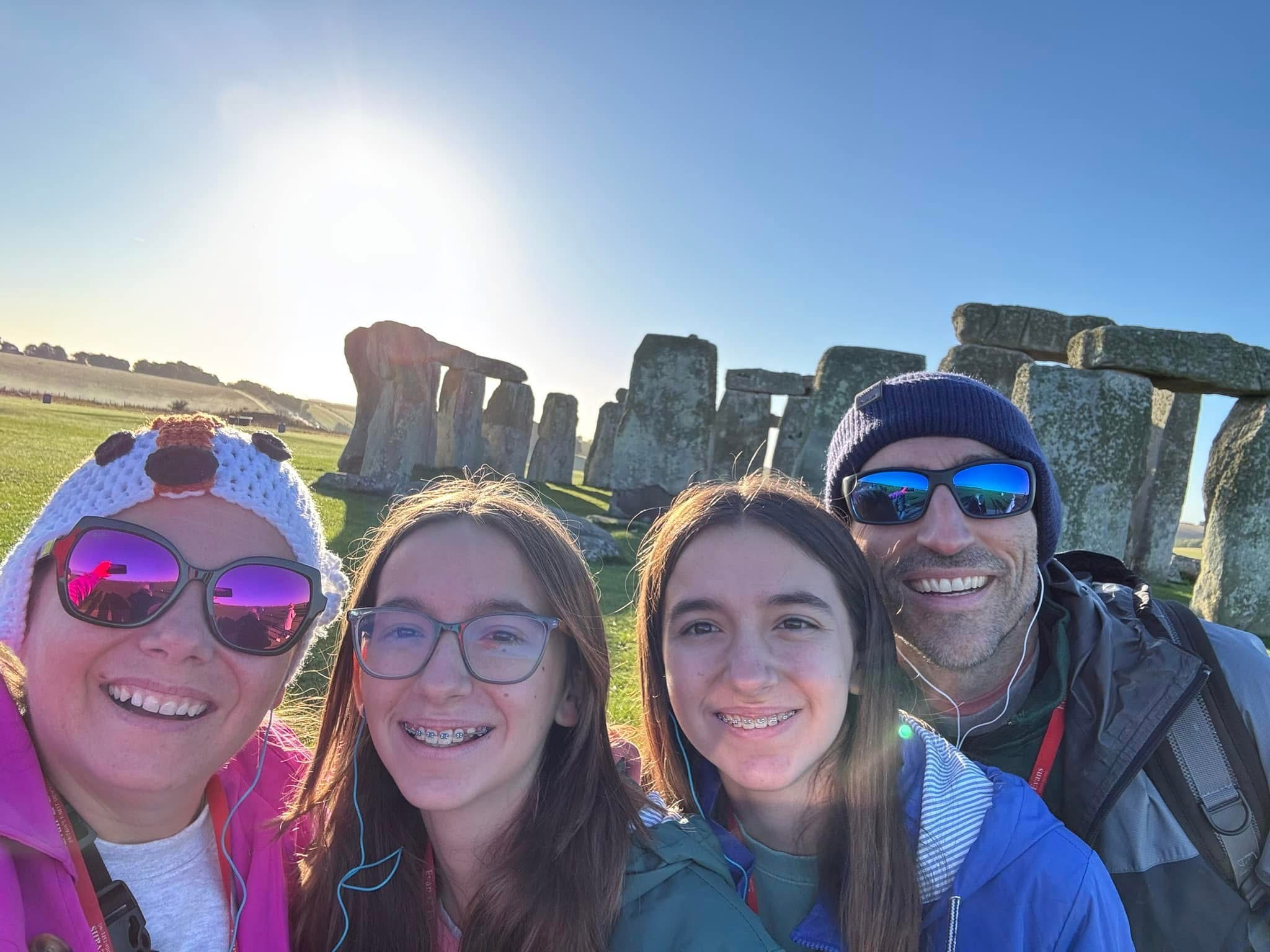 Dr. Leslie Falcon and family smiling together during their travels